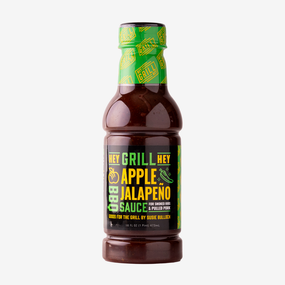 A bottle of Apple Jalapeno BBQ Sauce on a white background.