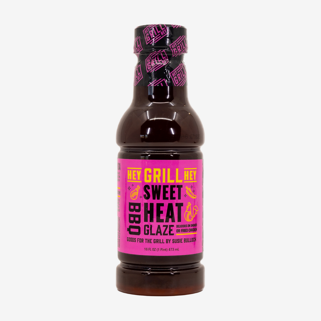 A bottle of Sweet Heat BBQ Glaze on a white background. 