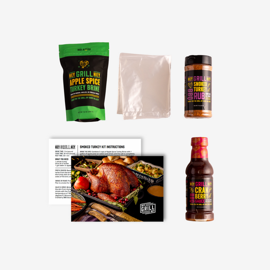 An image of the items included in the box. Items are: Apple Spice Turkey Brine, a brine bag, smoked Turkey Rub, a recipe card, and a bottle of Cranberry glaze. 